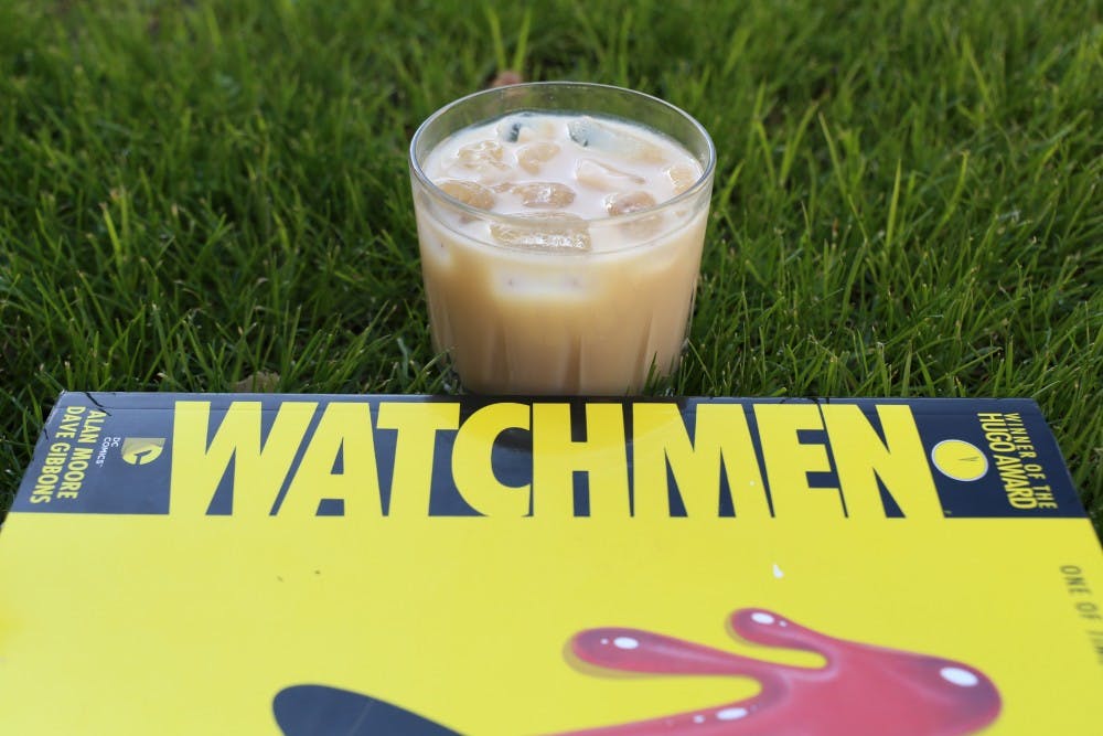 This week, columnist Carson Abernethy pairs 'Watchmen' by&nbsp;Alan Moore, with art done by Dave Gibbons&nbsp;and coloring done by John Higgins, with a White Russian.&nbsp;Photo done on Tuesday, April 12, 2016.