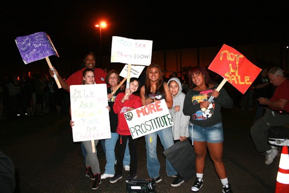 SHOWING SUPPORT: Formerly prostituted women and their families and supporters marched in Phoenix Saturday near 28th Avenue and Indian School to commemorate those who lost their lives and bring awareness to domestic sex trafficking. (Photo by Leandra Huffer)