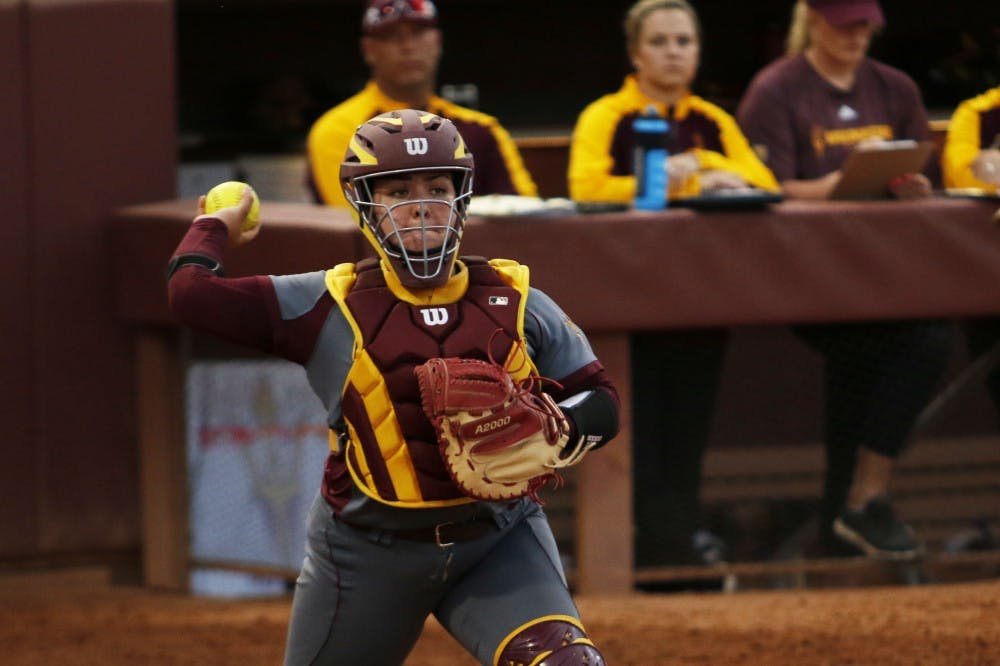 Senior catcher Sashel Palacios (13) looks to throw the ball to first base in a game against Purdue at Alberta B. Farrington Softball Stadium in Tempe, Arizona, on Friday, Feb. 10, 2017. The Sun Devils won the game, 3-0.
