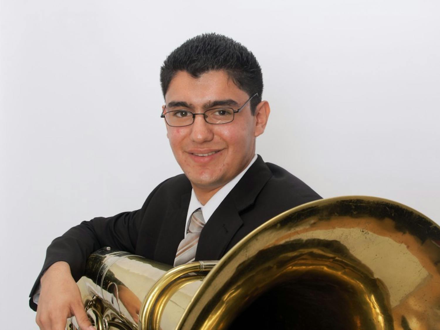 Third-year undergraduate music performance student Ramon Garavito, Jr. poses with his tuba in September,&nbsp;2014. He will be performing in his fourth undergraduate recital on Saturday Oct. 29, 2016.
