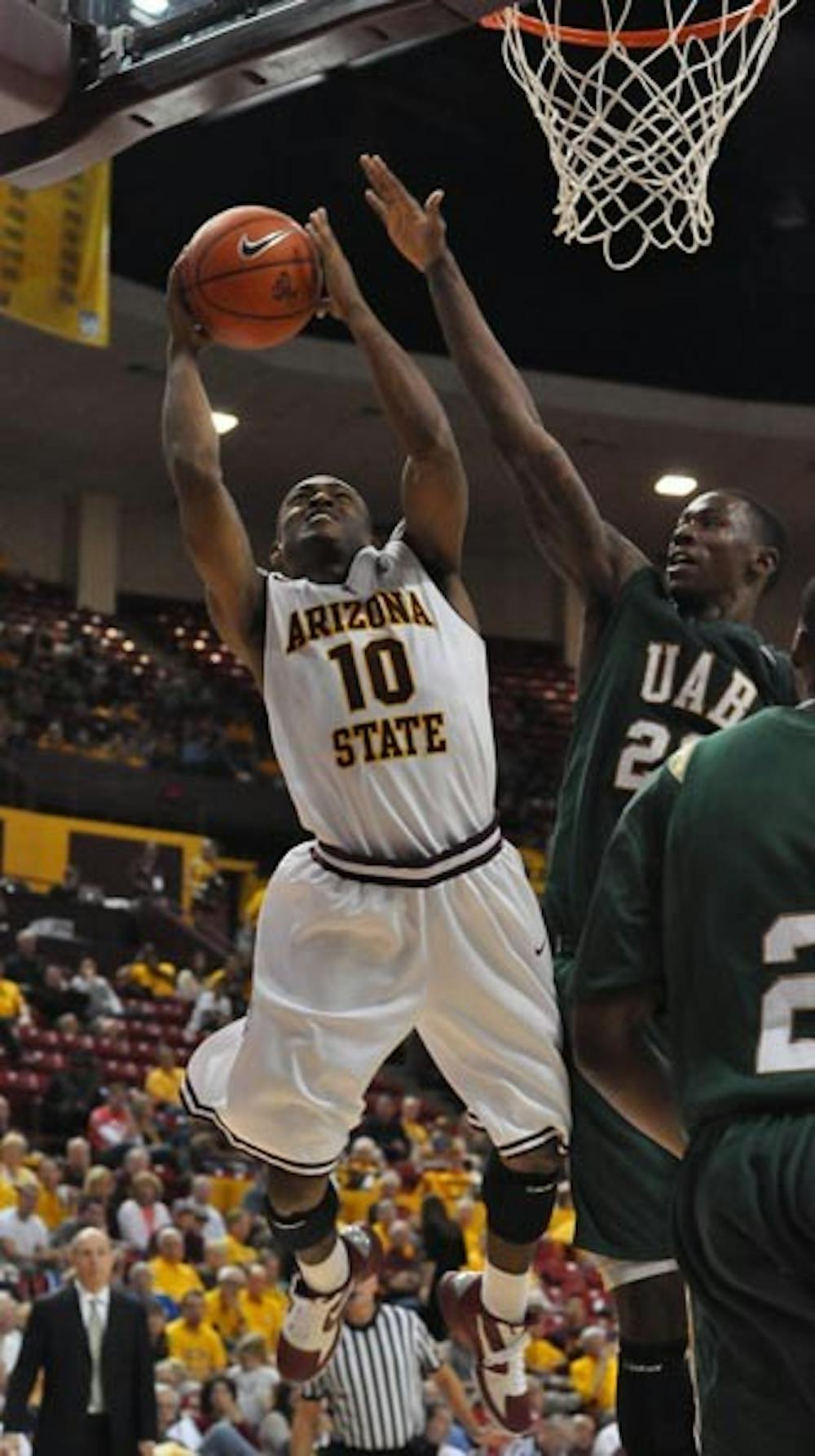 RISE UP: Senior guard Jamelle McMillan goes up for a layup against UAB during the Sun Devils home opener on Nov. 20. ASU fell to the undefeated No. 11 Baylor Bears 68-54 Thursday night. (Photo by Aaron Lavinsky)