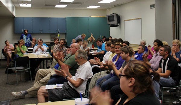 Tempe residents in attendance at the Legislative District 26 Democrats meeting in the Escalante Community Center Tuesday night cheered after hearing news of Ron Barber, a candidate in the special election to replace Gabrielle Giffords seat in  Arizona's Congressional District 9, leading the race. (Photo by Shawn Raymundo)