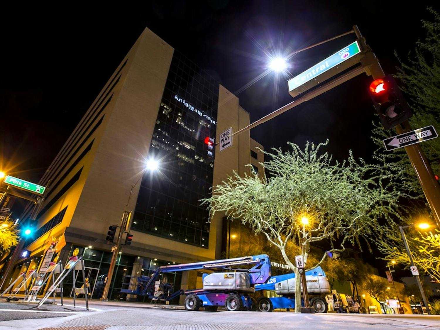 Construction equipment waits at the base of ASU's University Center in Downtown Phoenix on Friday, Oct. 9, 2015. Large banners will be hung from the south side of the University Center building this week as part of an ASU promotional campaign. 
