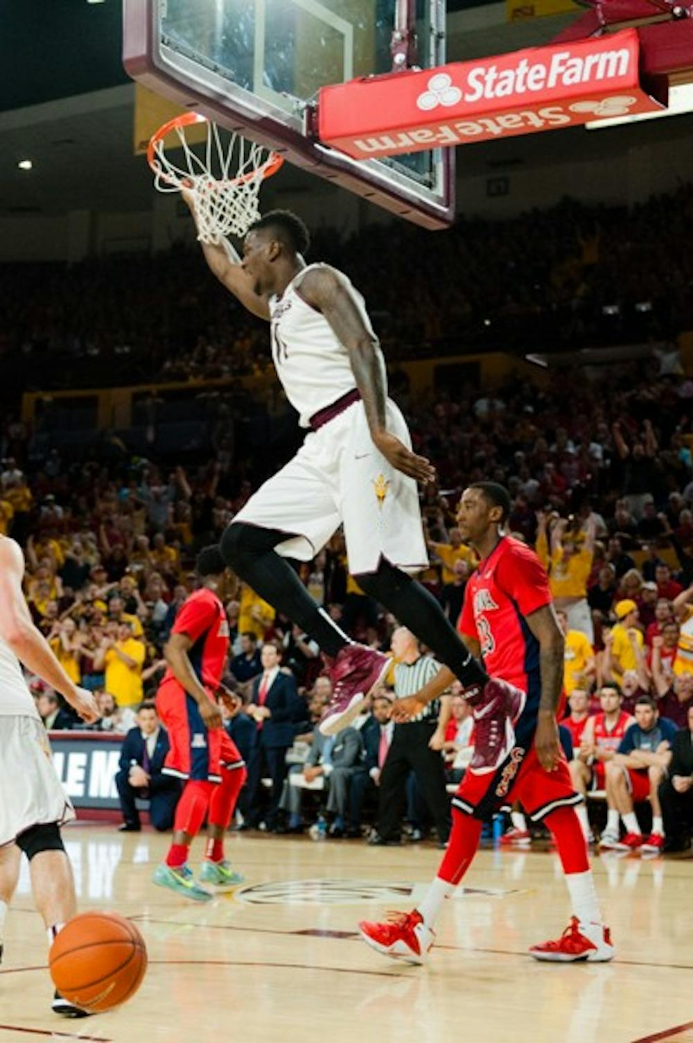 Sophomore forward Savon Goodman alley-oops the ball in the first half against Arizona, Saturday, Feb. 7, 2015 at Wells Fargo Arena in Tempe. The Sun Devils defeated the Wildcats 81-78. (Ben Moffat/The State Press)
