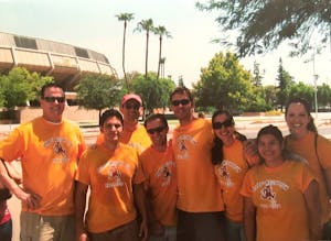 Hope Church members, including&nbsp;Ashley Perea, second from right, pose for a photo in front of Wells Fargo Arena. 