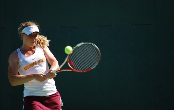 Senior Hannah James clinches her racket as she attempts to return a volley against Saint Mary’s on March 2. James steps into the No. 4 spot this weekend in place of injured freshman Stephanie Vlad. (Photo by Murphy Bannerman)