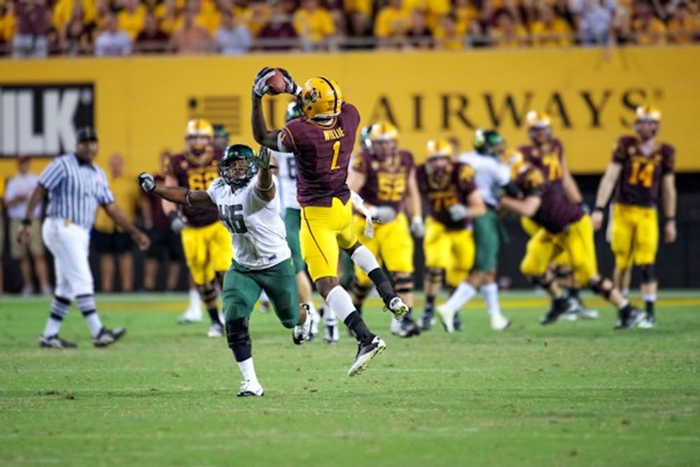 TURN AND GRAB: ASU senior wide receiver Mike Willie makes a catch during the Sun Devil’s loss to Oregon last year. The play of ASU’s receiving corps will be a big factor on Saturday. (Photo by Michael Arellano)