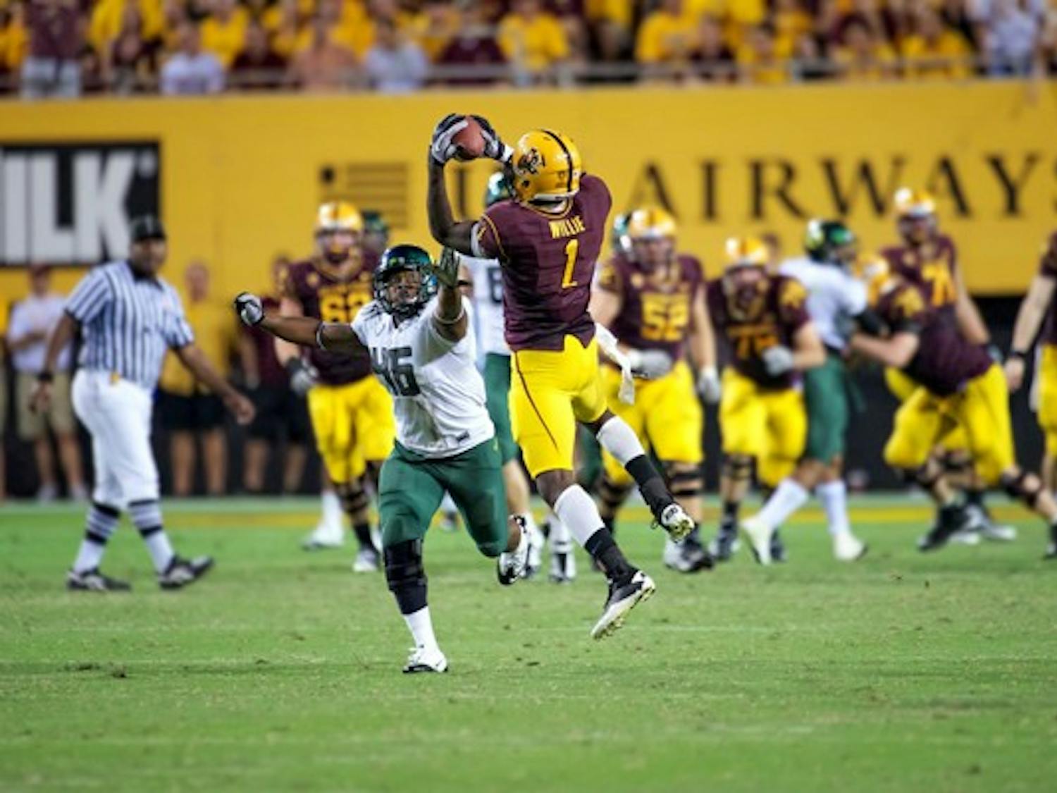 TURN AND GRAB: ASU senior wide receiver Mike Willie makes a catch during the Sun Devil’s loss to Oregon last year. The play of ASU’s receiving corps will be a big factor on Saturday. (Photo by Michael Arellano)