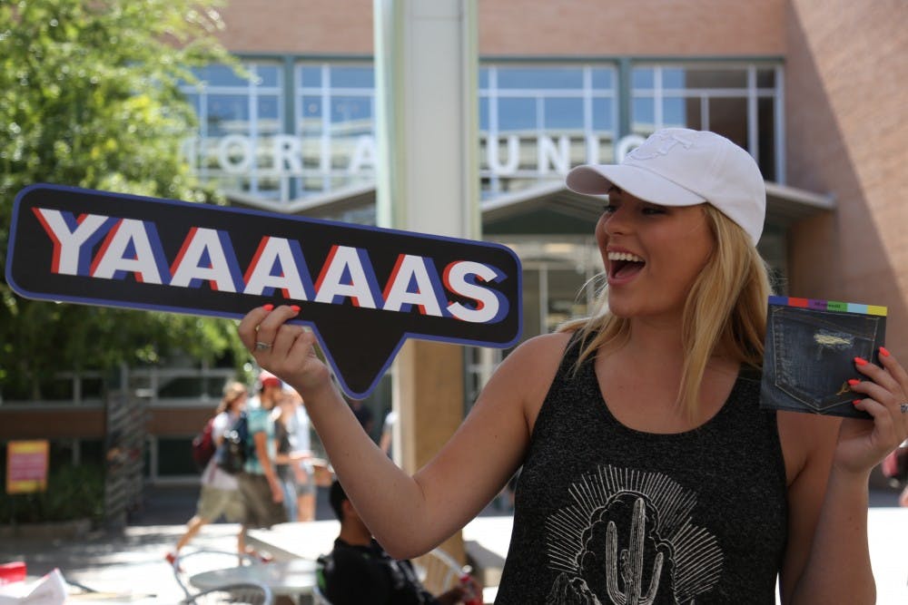 Sophomore&nbsp;Taylor Harris poses with the Express props after stopping at their&nbsp;Denim Campus Hunt event held at the&nbsp;Memorial Union building&nbsp;on Oct. 3, 2016.