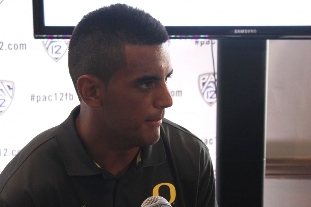 Oregon quarterback Marcus Mariota speaks to media on day one of Pac-12 Football Media Day. (Photo by Bill Slane)