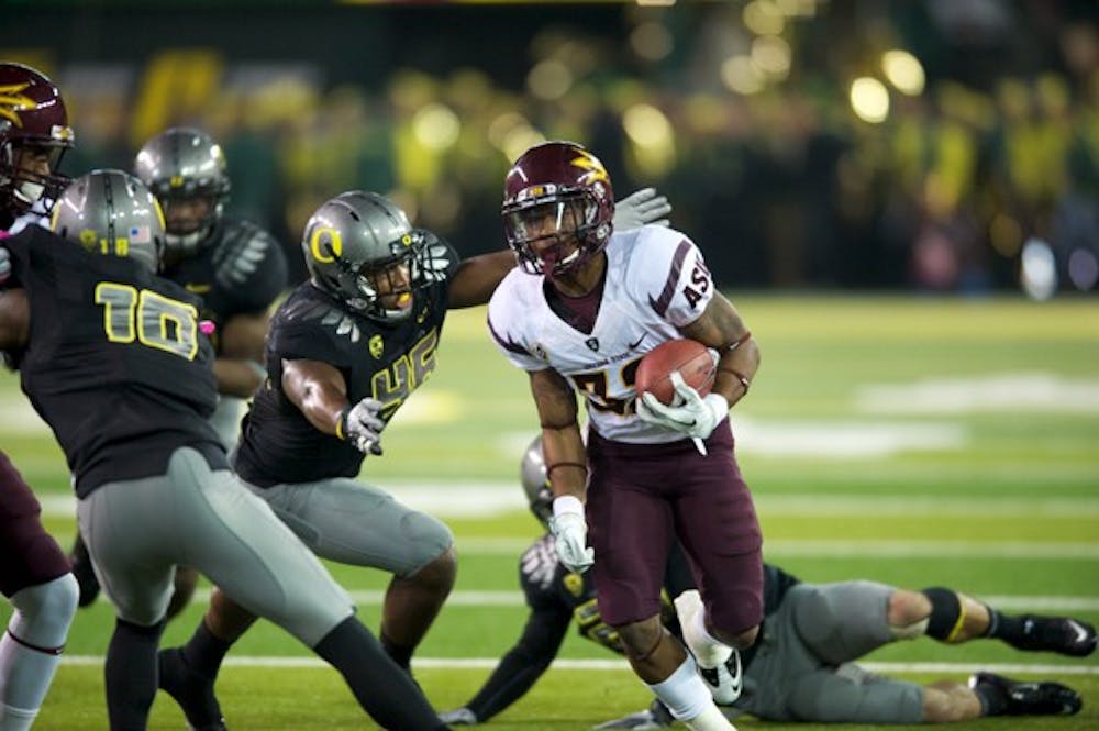 ASU junior wide receiver Jamal Miles sprints past a group of Oregon defenders during the Sun Devils’ loss to Oregon on Oct. 15. With the right series of events, ASU could still meet Oregon in the Pac-12 Championship game. (Photo by Michael Arelleano)