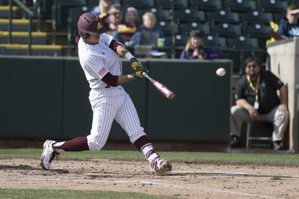 ASU freshman first baseman Lyle Lin (27) slugs a double into the outfield gap during a baseball game against the Northwestern Wildcats at Phoenix Municipal Stadium in Phoenix on Sunday, Feb. 20, 2017. ASU won 6-2. (Josh Orcutt/State Press)