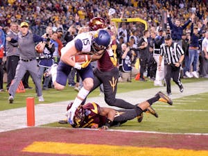 Freshman David Sills, in at wide receiver, makes the catch and crosses the goal line amid defensive pressure to score WVU's final touchdown during the 2016 Motel 6 Cactus Bowl. The Mountaineers wins over ASU 43 - 42 at Chase Field in Phoenix, AZ.