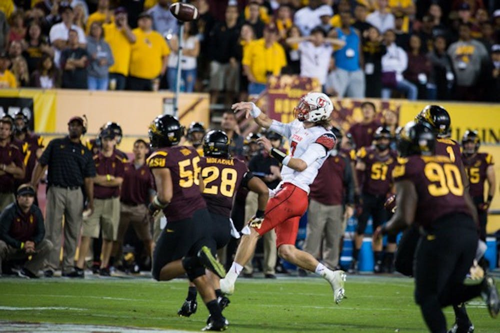 Utah quarterback Travis Wilson gets rushed by redshirt sophomore linebacker Viliami (Laiu) Moeakiola during the 2nd half of the game against Utah on Nov 1. ASU defeated Utah in overtime 19-16. (Photo by Andrew Ybanez)