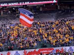 Paratroopers deliver the game ball and flag before the Motel 6 Cactus Bowl at Chase Field in Phoenix Arizona. (J. Bauer-Leffler/The State Press)