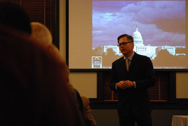Political science professor Patrick Kenney discusses the 2012 election during a forum at the University Club on the Tempe campus Thursday night. (Photo by Murphy Bannerman)