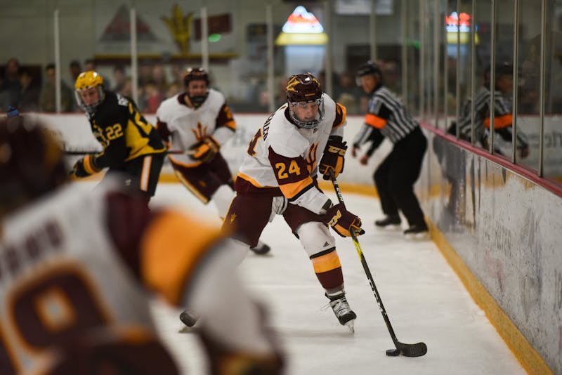 ASU now-sophomore defenseman Joshua Maniscalco (24) handles the puck in ASU’s 5-4 overtime victory over American International in Oceanside Ice Arena in Tempe on Saturday, Feb. 17, 2019.