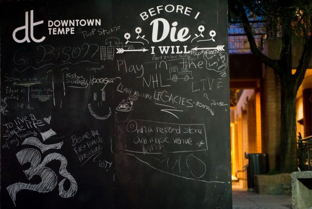 The "Before I die, I will" chalkboard located at the intersection of 3rd Street and Mill Avenue is pictured on Thursday, Feb. 11, 2016.&nbsp;