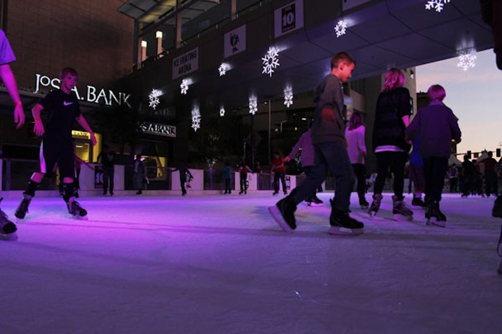 NRG hosts CitySkate, a set-up holiday ice rink, at Cityscape in downtown Phoenix. Friends, couples and families enjoy the temporary outdoor rink to the sound of holiday music. (Photo by Ana Ramirez)