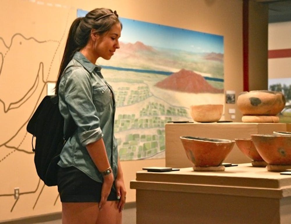 AQUATIC PRECEDENT: Danae Juarez, a global studies and Spanish freshman, takes a break between classes to visit the "Choosing a Future with Water: Lessons from the Hohokam" exhibit at the ASU Anthropology Museum. (Photo by Rosie Gochnour)