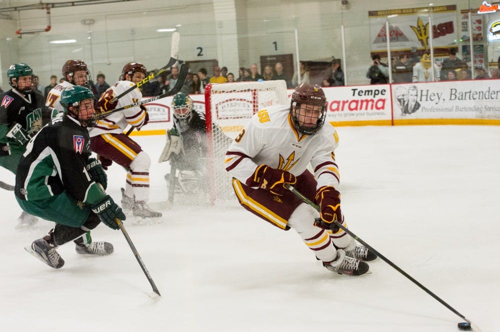 Freshman Forward Ryan Stevens takes the puck behind the goal as ASU  regroups Friday January 22, 2016 at the Oceanside Arena in Tempe, AZ.