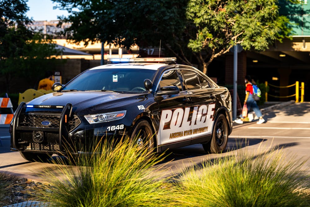 ASU Police Department car pictured blocking traffic during Sparky's Tailgate.