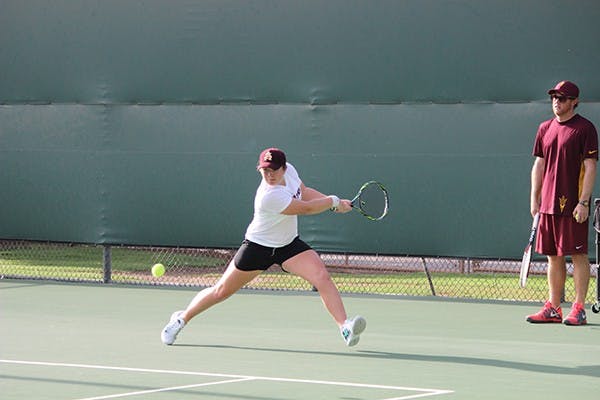 ASU freshman Gussie O'Sullivan swings at the ball during a practice in Tempe. O'Sullivan is adjusting to life in Arizona after moving home 8,000 miles away in Australia. (Phtoo by Evan Webeck)