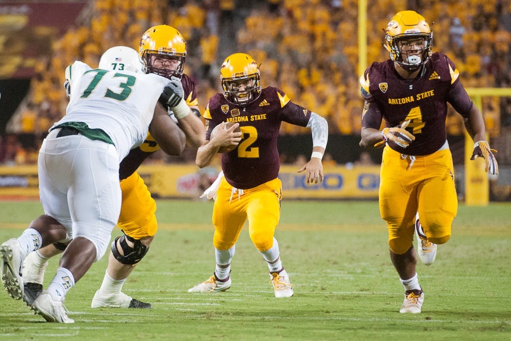 Redshirt senior quarterback Mike Bercovici (2) scrambles under pressure against Cal Poly on Saturday, Sept. 12, 2015, at Sun Devil Stadium in Tempe.