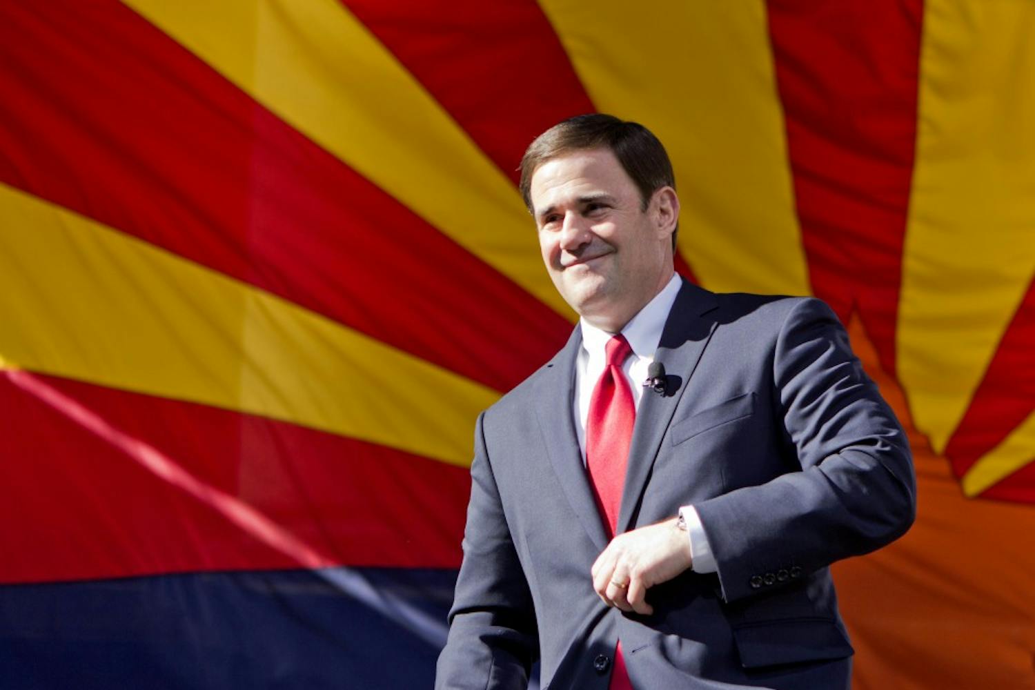 Gov. Doug Ducey walks on stage to take his oath of office at the state Capitol courtyard on Jan. 5, 2015.