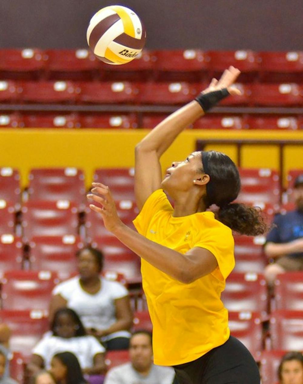 SERVE'S UP: ASU junior middle blocker Erica Wilson swings her arm on a serve during the preseason Alumnae Match. Wilson and the SUn Devils will play their road opener Friday at the Iowa State Challenge. (Photo by Aaron Lavinsky)