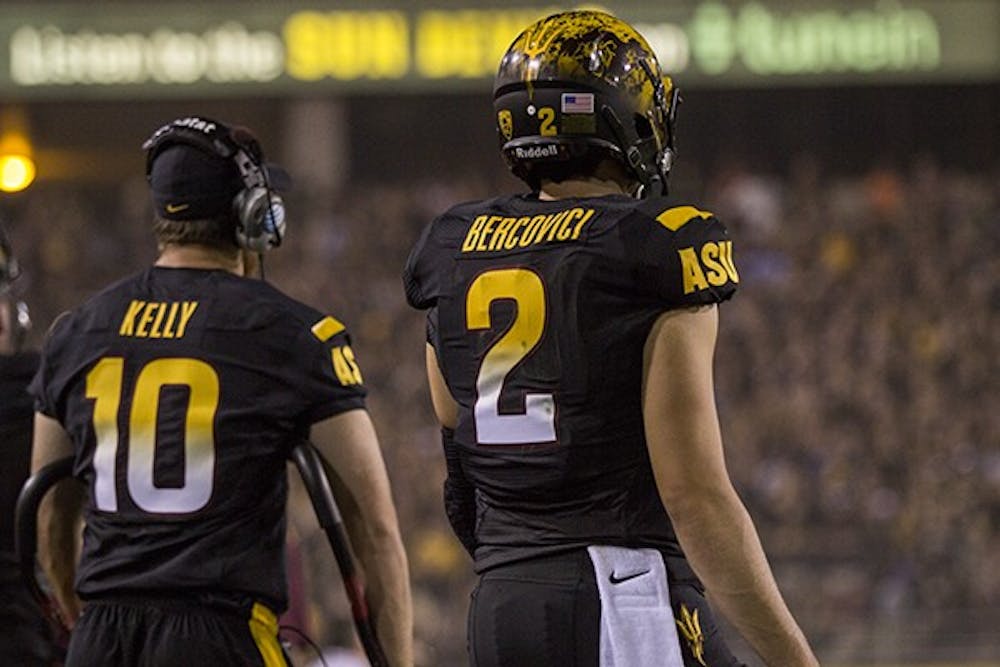 Injured redshirt senior quarterback Taylor Kelly and redshirt junior quarterback Mike Bercovici watch from the sidelines at home game against UCLA on Sept. 25, 2014. The Sun Devils lost to the Bruins, 62-27. (Photo by Alexis Macklin)
