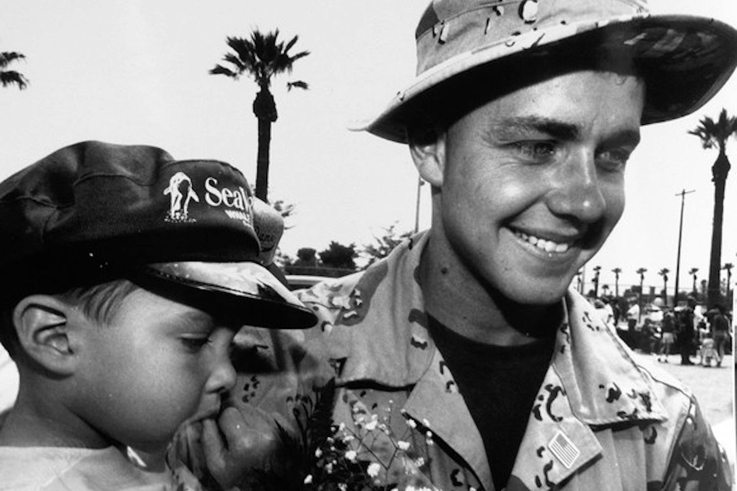 WELCOME HOME: Civil engineering major Lance Corporal Noel Collier is greeted by his three-year-old nephew Jordan Garcia in 1991. Collier was in the gulf for six months. (Photo by Irwin Daugherty)