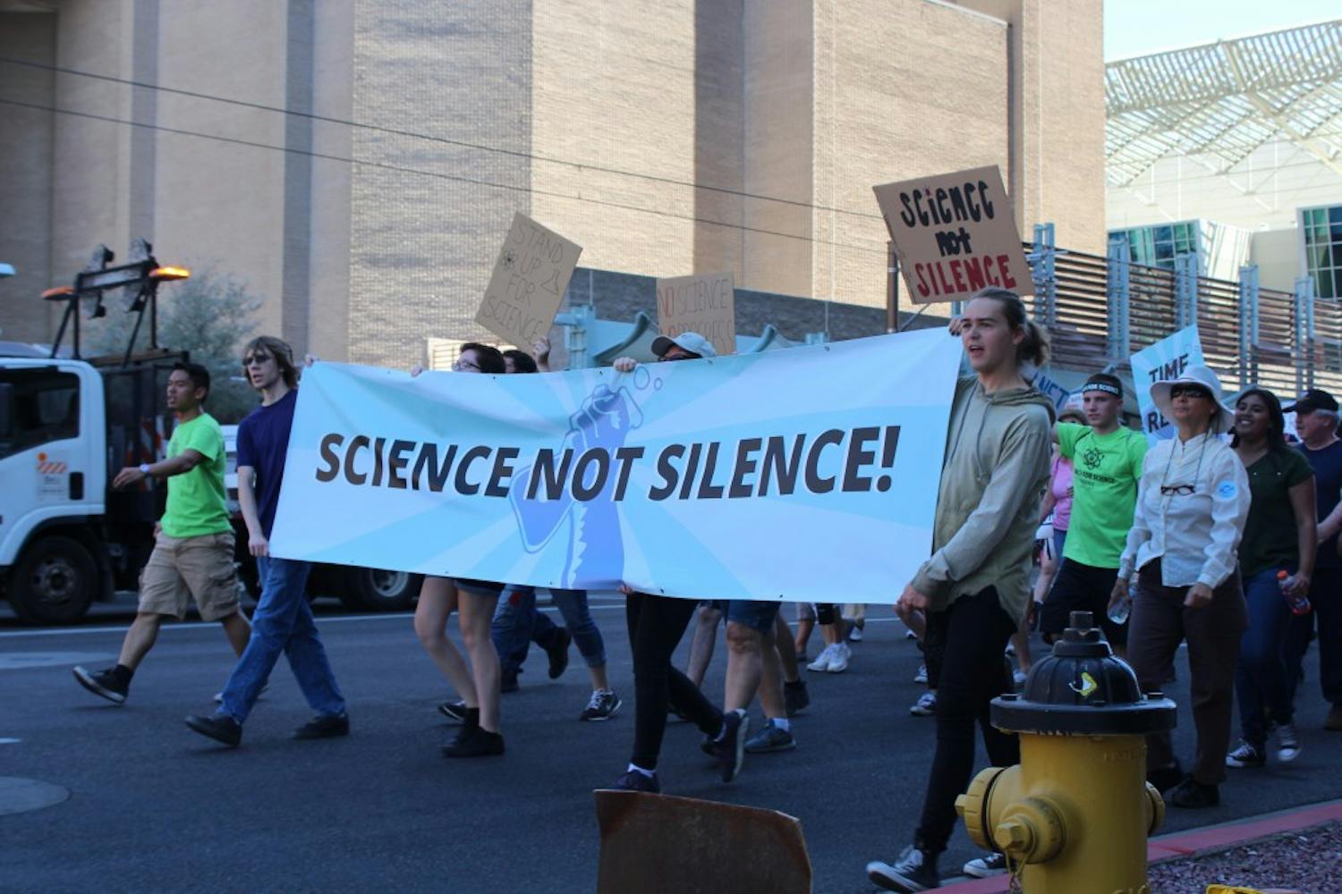 Protesters march down Washington Avenue in downtown Phoenix on Saturday,&nbsp;April 22, 2017&nbsp;as part of the nationwide March for Science.