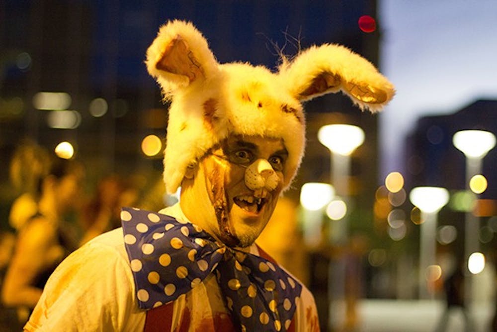 Fake zombies walk the streets of Downtown Phoenix during Zombie Walk 5. About 10,000 people were expected to attend the event.  (Photo by Diana Lustig)