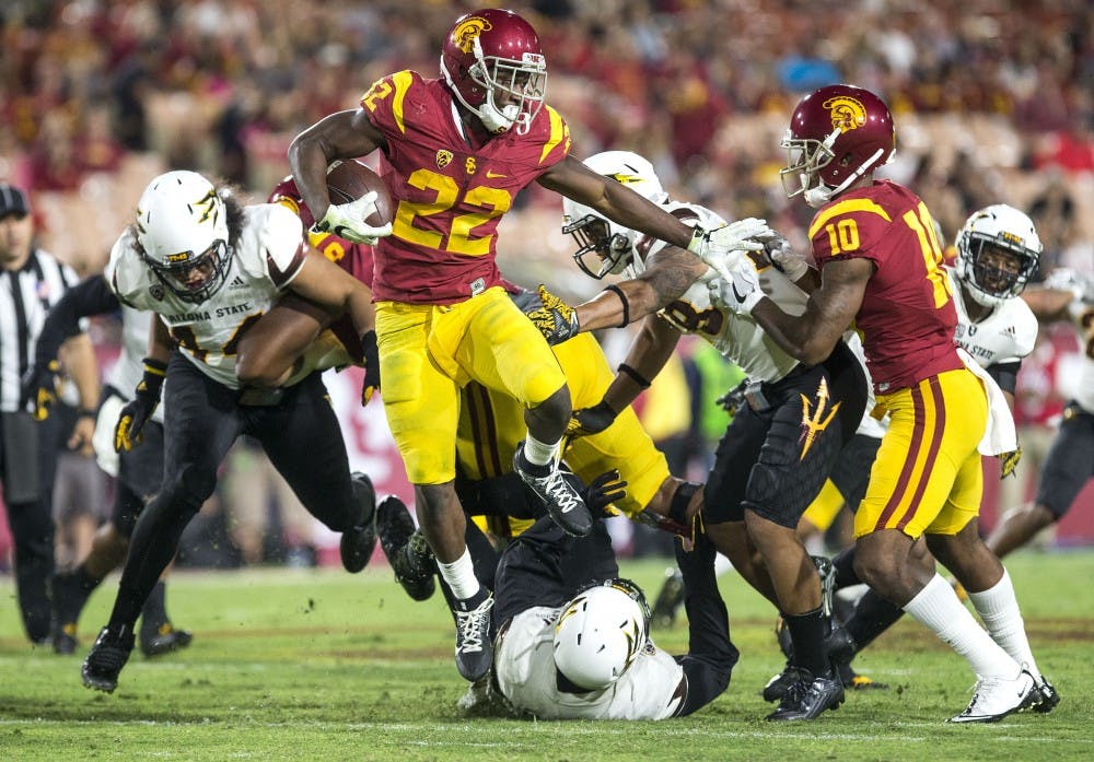 Trojan wide receiver Josh Imatorbhebhe (22) carries the ball upfield during a game against the USC Trojans in the Los Angeles Memorial Coliseum on Saturday, Oct. 1, 2016. 
