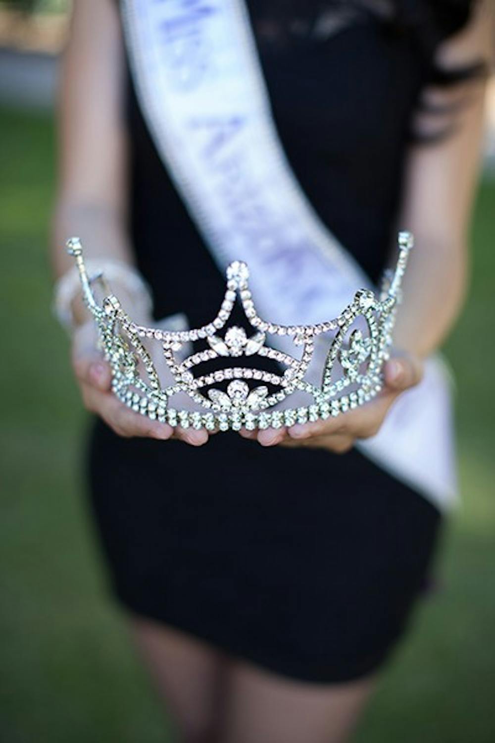 Brenda Soto presents her tiara that she was crowned with at the pageant after being named Miss Arizona Latina 2013. (Photo by Ryan Liu)