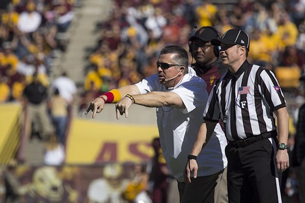 Coach Todd Graham motions to his team in a home game against Washington State at Sun Devil Stadium on Saturday, Nov. 22, 2014. ASU won against Washington State 52-31. (Photo by Alexis Macklin)