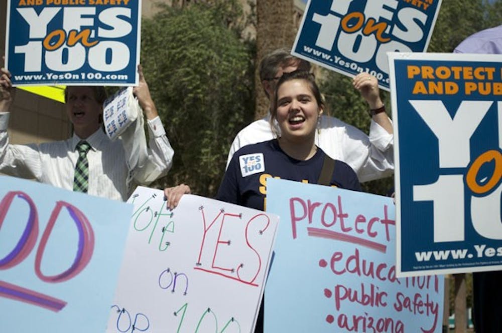 TAX-HIKE: Junior political science major, and Arizona Students' Association intern, Sarah Blaine attended a rally focused around Prop 100. The prop will be on the May 18, 2010 special election ballot and centers around a temporary one-cent sales tax increase in the state. (Photo by Molly J. Smith)