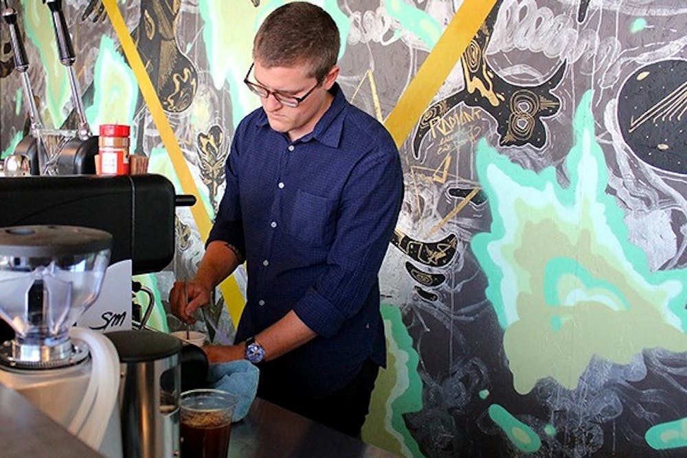 Braden Hammond, a barista at the newly opened Royal Coffee Bar in Tempe, said that their menu isn't strict and they can fulfill pretty much any coffee or tea order that a customer requests. (Photo by Brittany Schmus)