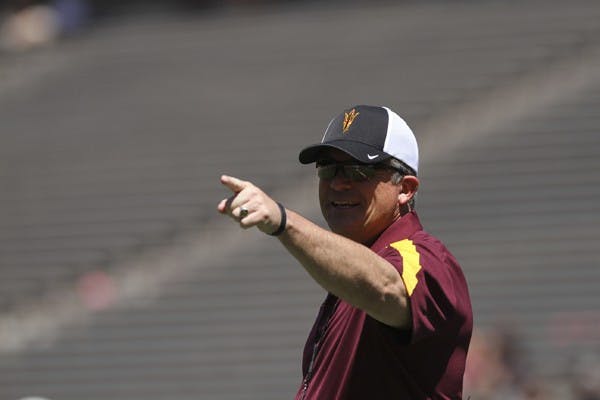 Football coach Todd Graham signals commands during ASU’s Spring Game last April. The Sun Devils open Graham’s inaugural season on Aug. 30 against NAU. Photo by Sam Rosenbaum
