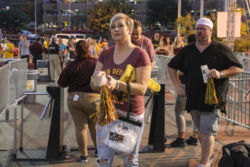 Fans enter Sun Devil Stadium with clear plastic bags during a game against UCLA on Oct. 8, 2016.&nbsp;