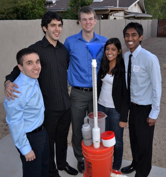 Biomedical engineering students (from left to right) Paul Strong, Mark Huerta, Connor Wiegand, Pankti Shah, and Varendra Silva form “33 Buckets,” an Engineering Projects in Community Service team that built a prototype water filter. The students are working to raise money to go to Bangladesh to install the filter in a school this summer. (Photo by Brittany Lea)