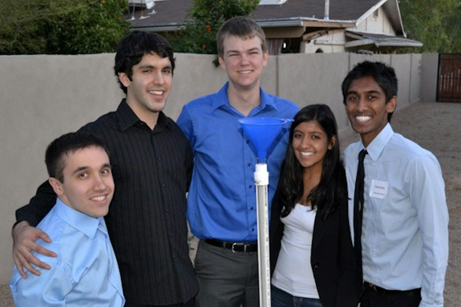 Biomedical engineering students (from left to right) Paul Strong, Mark Huerta, Connor Wiegand, Pankti Shah, and Varendra Silva form “33 Buckets,” an Engineering Projects in Community Service team that built a prototype water filter. The students are working to raise money to go to Bangladesh to install the filter in a school this summer. (Photo by Brittany Lea)