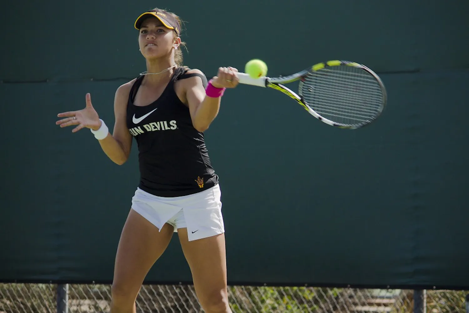 ASU Junior Desirae Krawczyk returns a forehand during her 6-4, 6-2 straight set win against BYU’s Mayci Jones on Feb. 14, 2015, at the Whiteman Tennis Center in Tempe. (Shiva Balasubramanian/The State Press)