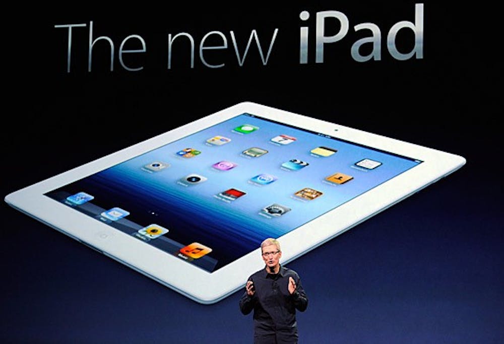 Apple Chief Executive Tim Cook introduces the new iPad. Photo from Kevork Djansezian / Getty Images.