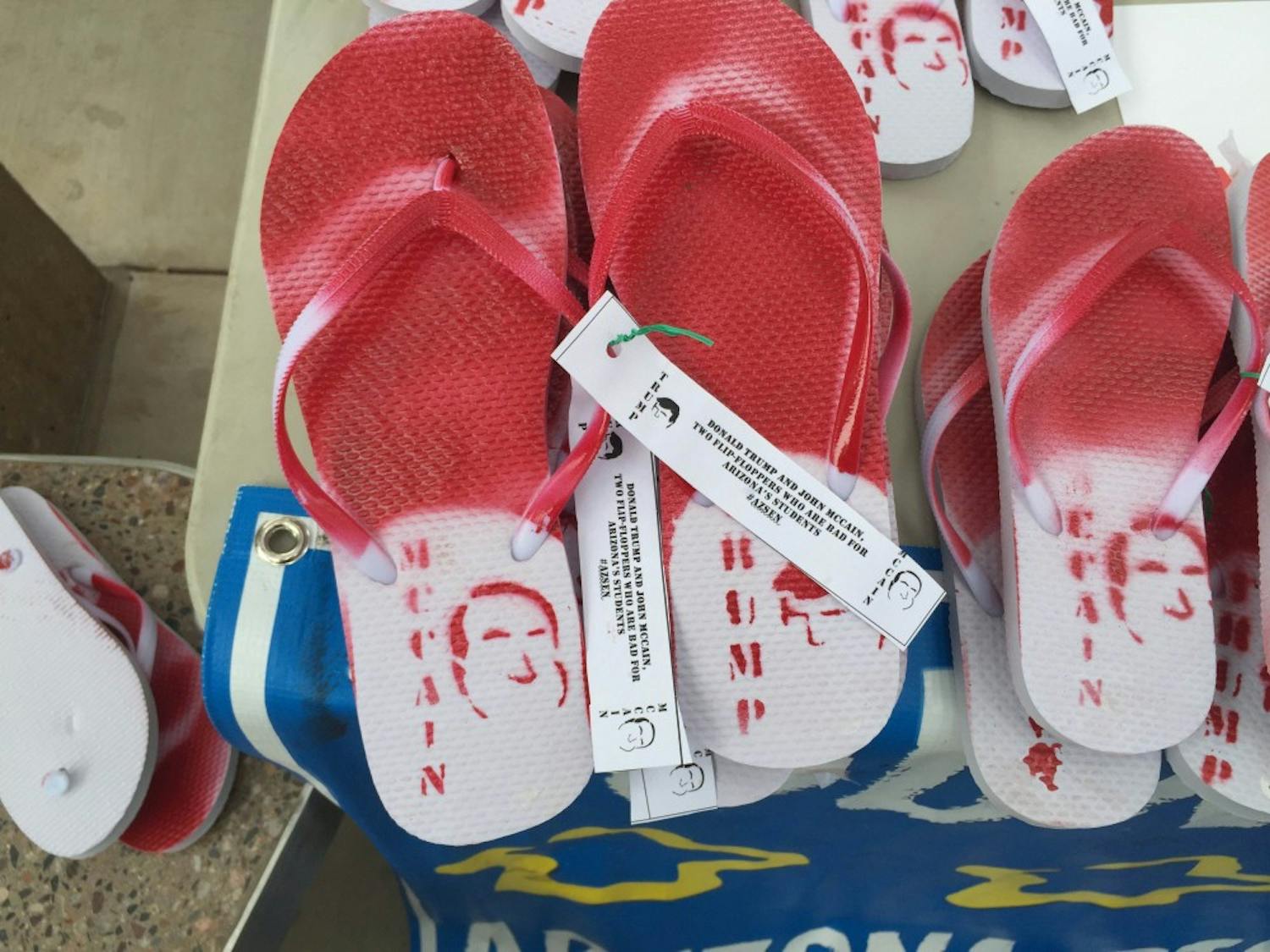 ASU Young Democrats handed out&nbsp;flip-flops to ASU students&nbsp;which called out&nbsp;U.S. Sen. John McCain (R-AZ) and GOP presidential nominee Donald Trump for being "flip-floppers" on their political views regarding education&nbsp;on Wednesday, Sept. 7, 2016.