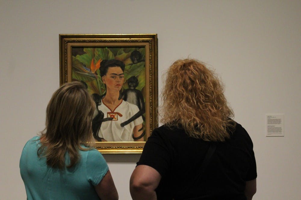 Two guests of the Heard Museum in Phoenix admire Frida Kahlo's "Self Portrait with Monkeys, 1943." The Frida Kahlo and Diego Rivera exhibit is in Phoenix until Aug. 20, 2017, its only stop in North America.