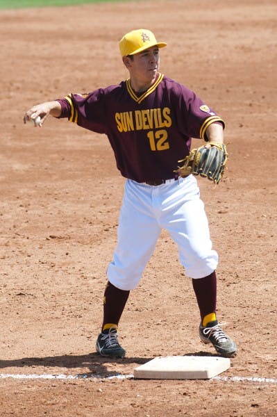 Freshman infielder Emilio Torrez catches the ball at third base and throws the ball around the horn on vs. Oregon April 7. The ASU baseball team looks to keep their conference series winning streak alive against Utah. (Photo by Molly J. Smith)