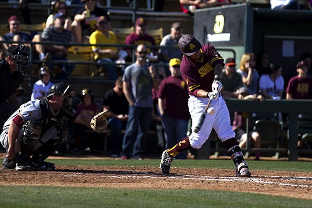 Sophomore catcher RJ Ybarra hits the ball during a match against the ASU alumni team at Packard Stadium on Feb. 8, 2014. (Photo by Diana Lustig)