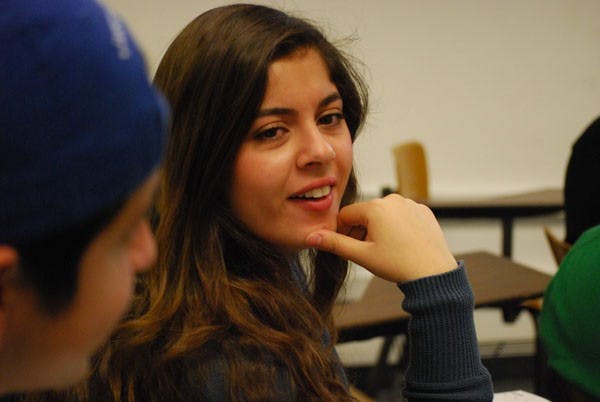 Biochemistry freshman Anna Salibi discusses a skit for an upcoming show for charity. The comedy clubs preforms every Friday in the Memorial Union. (Photo by Murphy Bannerman)